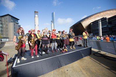 061019 - Cardiff Half Marathon 2019 - Runners make their way through Cardiff Bay, Roald Dahl Plas and past the Wales Millennium Centre at the halfway point of the race