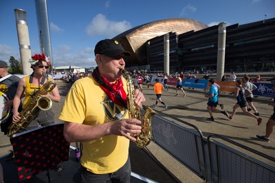 061019 - Cardiff Half Marathon 2019 - Runners make their way through Cardiff Bay, Roald Dahl Plas and past the Wales Millennium Centre at the halfway point of the race