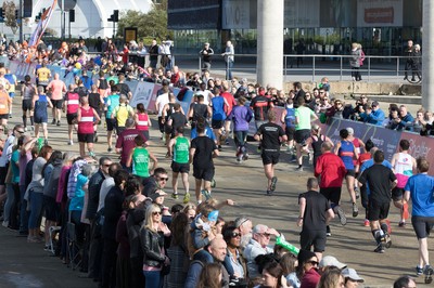 061019 - Cardiff Half Marathon 2019 - Runners make their way through Cardiff Bay, Roald Dahl Plas and past the Wales Millennium Centre at the halfway point of the race