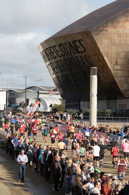 061019 - Cardiff Half Marathon 2019 - Runners make their way through Cardiff Bay, Roald Dahl Plas and past the Wales Millennium Centre at the halfway point of the race