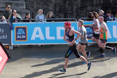 061019 - Cardiff Half Marathon 2019 - Runners make their way through Cardiff Bay, Roald Dahl Plas and past the Wales Millennium Centre at the halfway point of the race