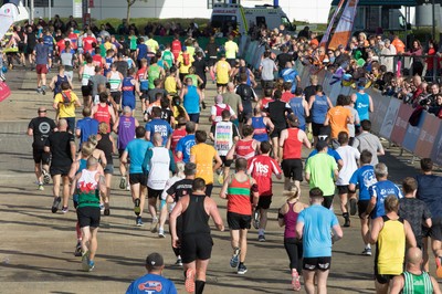 061019 - Cardiff Half Marathon 2019 - Runners make their way through Cardiff Bay, Roald Dahl Plas and past the Wales Millennium Centre at the halfway point of the race