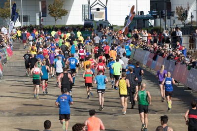 061019 - Cardiff Half Marathon 2019 - Runners make their way through Cardiff Bay, Roald Dahl Plas and past the Wales Millennium Centre at the halfway point of the race