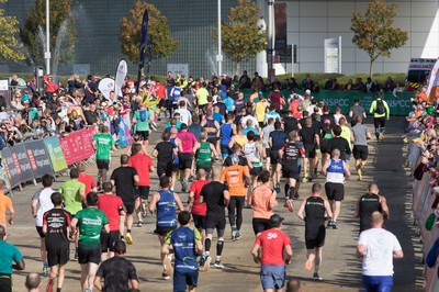 061019 - Cardiff Half Marathon 2019 - Runners make their way through Cardiff Bay, Roald Dahl Plas and past the Wales Millennium Centre at the halfway point of the race