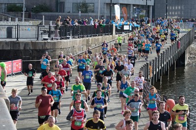 061019 - Cardiff Half Marathon 2019 - Runners make their way through Cardiff Bay, Roald Dahl Plas and past the Wales Millennium Centre at the halfway point of the race