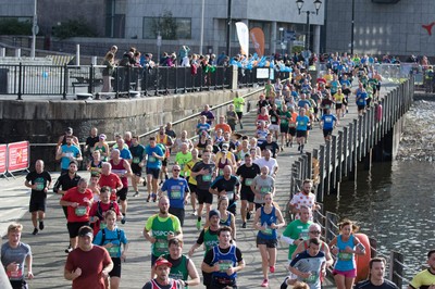 061019 - Cardiff Half Marathon 2019 - Runners make their way through Cardiff Bay, Roald Dahl Plas and past the Wales Millennium Centre at the halfway point of the race