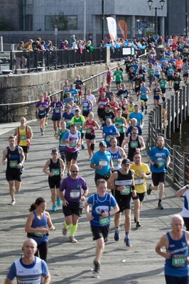 061019 - Cardiff Half Marathon 2019 - Runners make their way through Cardiff Bay, Roald Dahl Plas and past the Wales Millennium Centre at the halfway point of the race