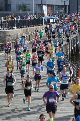 061019 - Cardiff Half Marathon 2019 - Runners make their way through Cardiff Bay, Roald Dahl Plas and past the Wales Millennium Centre at the halfway point of the race