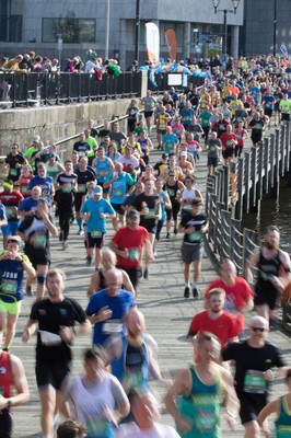 061019 - Cardiff Half Marathon 2019 - Runners make their way through Cardiff Bay, Roald Dahl Plas and past the Wales Millennium Centre at the halfway point of the race