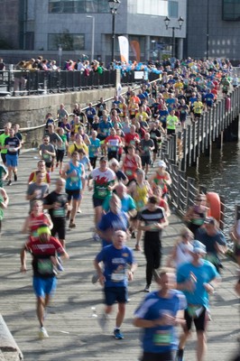 061019 - Cardiff Half Marathon 2019 - Runners make their way through Cardiff Bay, Roald Dahl Plas and past the Wales Millennium Centre at the halfway point of the race