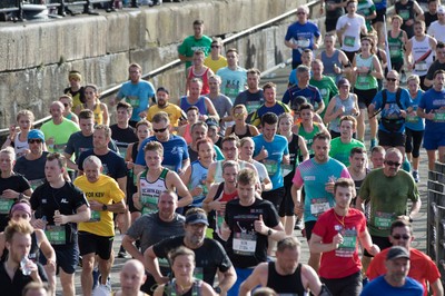 061019 - Cardiff Half Marathon 2019 - Runners make their way through Cardiff Bay, Roald Dahl Plas and past the Wales Millennium Centre at the halfway point of the race