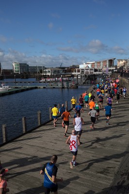 061019 - Cardiff Half Marathon 2019 - Runners make their way through Cardiff Bay, Roald Dahl Plas and past the Wales Millennium Centre at the halfway point of the race