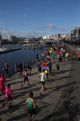 061019 - Cardiff Half Marathon 2019 - Runners make their way through Cardiff Bay, Roald Dahl Plas and past the Wales Millennium Centre at the halfway point of the race