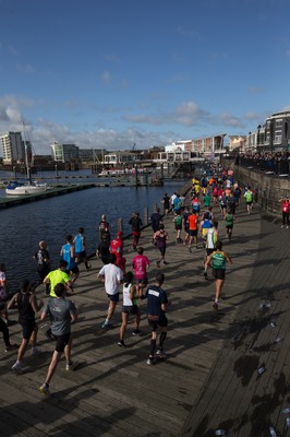 061019 - Cardiff Half Marathon 2019 - Runners make their way through Cardiff Bay, Roald Dahl Plas and past the Wales Millennium Centre at the halfway point of the race