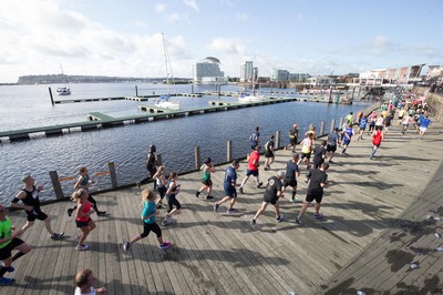 061019 - Cardiff Half Marathon 2019 - Runners make their way through Cardiff Bay, Roald Dahl Plas and past the Wales Millennium Centre at the halfway point of the race