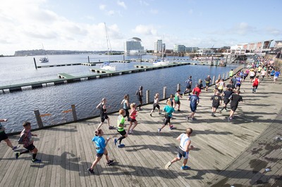 061019 - Cardiff Half Marathon 2019 - Runners make their way through Cardiff Bay, Roald Dahl Plas and past the Wales Millennium Centre at the halfway point of the race