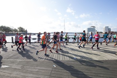 061019 - Cardiff Half Marathon 2019 - Runners make their way through Cardiff Bay, Roald Dahl Plas and past the Wales Millennium Centre at the halfway point of the race