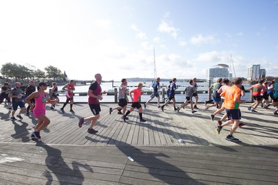 061019 - Cardiff Half Marathon 2019 - Runners make their way through Cardiff Bay, Roald Dahl Plas and past the Wales Millennium Centre at the halfway point of the race