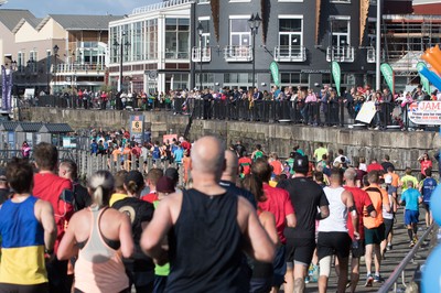 061019 - Cardiff Half Marathon 2019 - Runners make their way through Cardiff Bay, Roald Dahl Plas and past the Wales Millennium Centre at the halfway point of the race