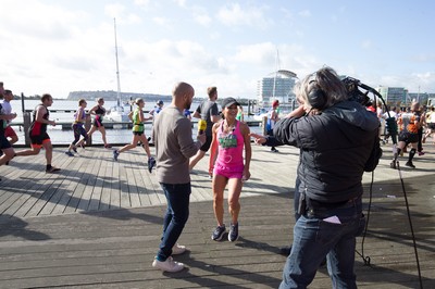 061019 - Cardiff Half Marathon 2019 - Runners make their way through Cardiff Bay, Roald Dahl Plas and past the Wales Millennium Centre at the halfway point of the race