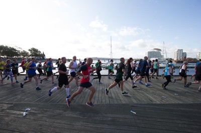 061019 - Cardiff Half Marathon 2019 - Runners make their way through Cardiff Bay, Roald Dahl Plas and past the Wales Millennium Centre at the halfway point of the race