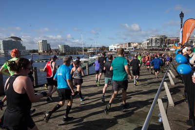 061019 - Cardiff Half Marathon 2019 - Runners make their way through Cardiff Bay, Roald Dahl Plas and past the Wales Millennium Centre at the halfway point of the race