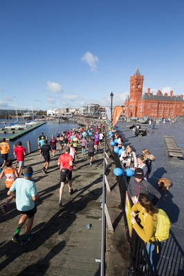 061019 - Cardiff Half Marathon 2019 - Runners make their way through Cardiff Bay, Roald Dahl Plas and past the Wales Millennium Centre at the halfway point of the race