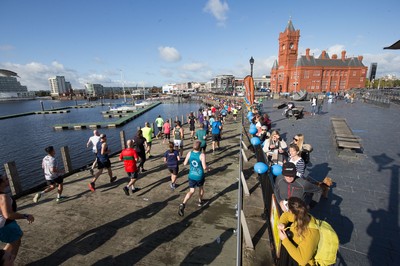 061019 - Cardiff Half Marathon 2019 - Runners make their way through Cardiff Bay, Roald Dahl Plas and past the Wales Millennium Centre at the halfway point of the race