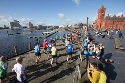 061019 - Cardiff Half Marathon 2019 - Runners make their way through Cardiff Bay, Roald Dahl Plas and past the Wales Millennium Centre at the halfway point of the race