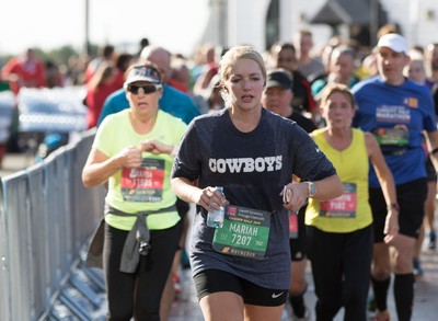 061019 - Cardiff Half Marathon 2019 - Runners make their way through Cardiff Bay, Roald Dahl Plas and past the Wales Millennium Centre at the halfway point of the race