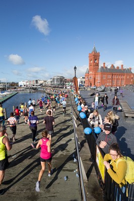 061019 - Cardiff Half Marathon 2019 - Runners make their way through Cardiff Bay, Roald Dahl Plas and past the Wales Millennium Centre at the halfway point of the race