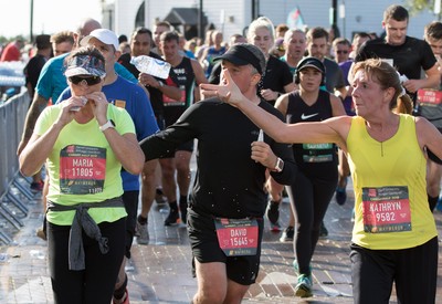 061019 - Cardiff Half Marathon 2019 - Runners make their way through Cardiff Bay, Roald Dahl Plas and past the Wales Millennium Centre at the halfway point of the race