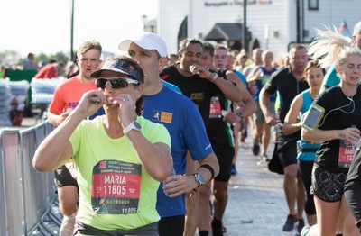 061019 - Cardiff Half Marathon 2019 - Runners make their way through Cardiff Bay, Roald Dahl Plas and past the Wales Millennium Centre at the halfway point of the race