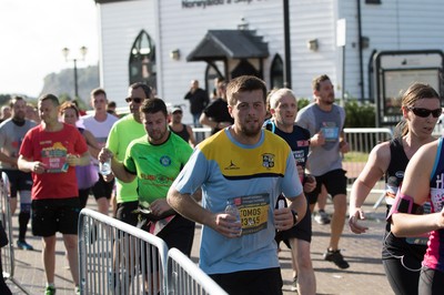 061019 - Cardiff Half Marathon 2019 - Runners make their way through Cardiff Bay, Roald Dahl Plas and past the Wales Millennium Centre at the halfway point of the race