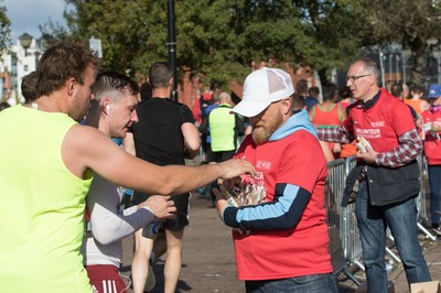 061019 - Cardiff Half Marathon 2019 - Runners make their way through Cardiff Bay, Roald Dahl Plas and past the Wales Millennium Centre at the halfway point of the race