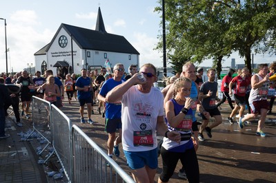 061019 - Cardiff Half Marathon 2019 - Runners make their way through Cardiff Bay, Roald Dahl Plas and past the Wales Millennium Centre at the halfway point of the race