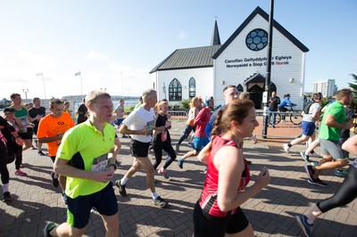 061019 - Cardiff Half Marathon 2019 - Runners make their way through Cardiff Bay, Roald Dahl Plas and past the Wales Millennium Centre at the halfway point of the race