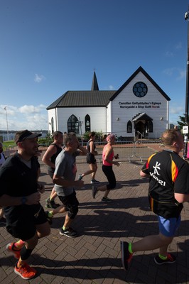 061019 - Cardiff Half Marathon 2019 - Runners make their way through Cardiff Bay, Roald Dahl Plas and past the Wales Millennium Centre at the halfway point of the race