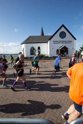 061019 - Cardiff Half Marathon 2019 - Runners make their way through Cardiff Bay, Roald Dahl Plas and past the Wales Millennium Centre at the halfway point of the race