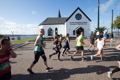 061019 - Cardiff Half Marathon 2019 - Runners make their way through Cardiff Bay, Roald Dahl Plas and past the Wales Millennium Centre at the halfway point of the race