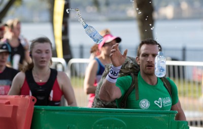 061019 - Cardiff Half Marathon 2019 - Runners recycle their water bottles as they make their way through Cardiff Bay, Roald Dahl Plas and past the Wales Millennium Centre at the halfway point of the race