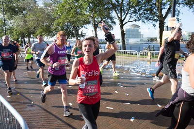 061019 - Cardiff Half Marathon 2019 - Runners make their way through Cardiff Bay, Roald Dahl Plas and past the Wales Millennium Centre at the halfway point of the race