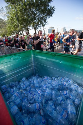 061019 - Cardiff Half Marathon 2019 - Runners recycle their water bottles as they make their way through Cardiff Bay, Roald Dahl Plas and past the Wales Millennium Centre at the halfway point of the race