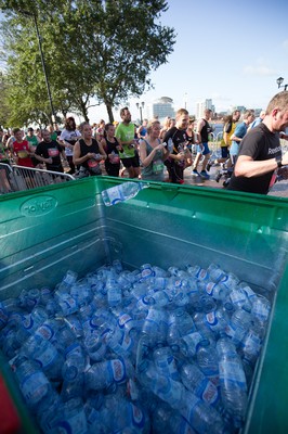 061019 - Cardiff Half Marathon 2019 - Runners recycle their water bottles as they make their way through Cardiff Bay, Roald Dahl Plas and past the Wales Millennium Centre at the halfway point of the race