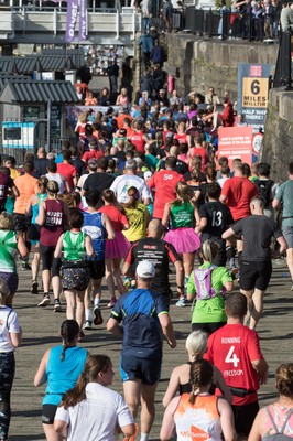 061019 - Cardiff Half Marathon 2019 - Runners make their way through Cardiff Bay, Roald Dahl Plas and past the Wales Millennium Centre at the halfway point of the race