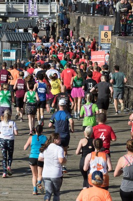 061019 - Cardiff Half Marathon 2019 - Runners make their way through Cardiff Bay, Roald Dahl Plas and past the Wales Millennium Centre at the halfway point of the race