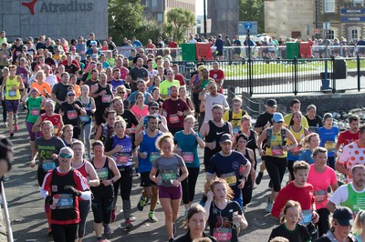 061019 - Cardiff Half Marathon 2019 - Runners make their way through Cardiff Bay, Roald Dahl Plas and past the Wales Millennium Centre at the halfway point of the race