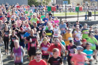 061019 - Cardiff Half Marathon 2019 - Runners make their way through Cardiff Bay, Roald Dahl Plas and past the Wales Millennium Centre at the halfway point of the race