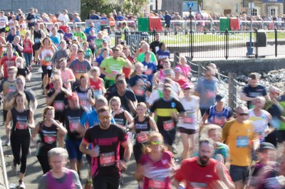 061019 - Cardiff Half Marathon 2019 - Runners make their way through Cardiff Bay, Roald Dahl Plas and past the Wales Millennium Centre at the halfway point of the race