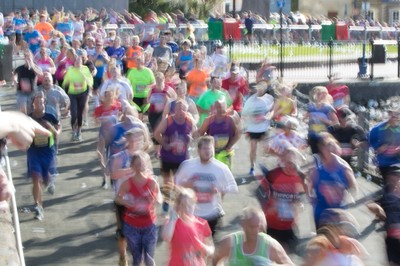 061019 - Cardiff Half Marathon 2019 - Runners make their way through Cardiff Bay, Roald Dahl Plas and past the Wales Millennium Centre at the halfway point of the race